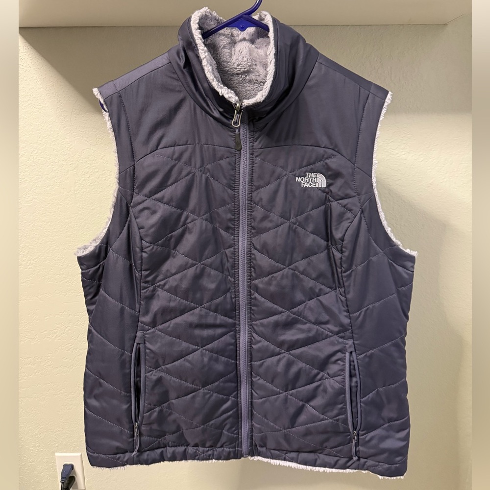 The North Face Reversible Vest with Moss-bud lining.